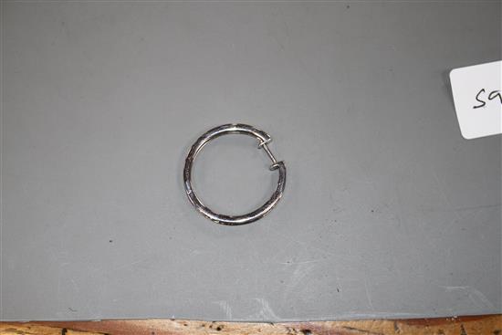 A modern single 14k white metal and baguette cut diamond set hoop earring, width 30mm, gross 5 grams.